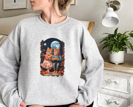 a woman wearing a sweatshirt with a picture of two cats on it