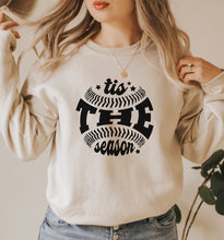 a woman wearing a sweatshirt that says it's free season