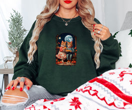 a woman sitting on a bed wearing a green sweatshirt