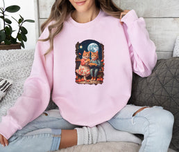 a woman sitting on a couch wearing a pink sweatshirt