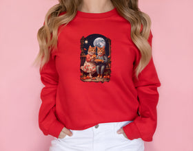 a woman wearing a red sweatshirt with a picture of a cat on it