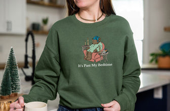 a woman standing in a kitchen holding a mug