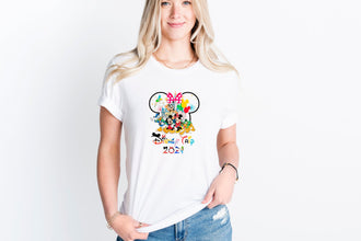 a woman wearing a mickey mouse t - shirt