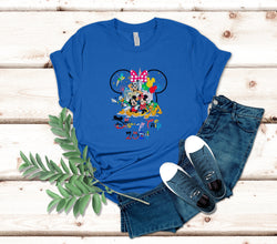 a blue shirt with mickey mouse on it